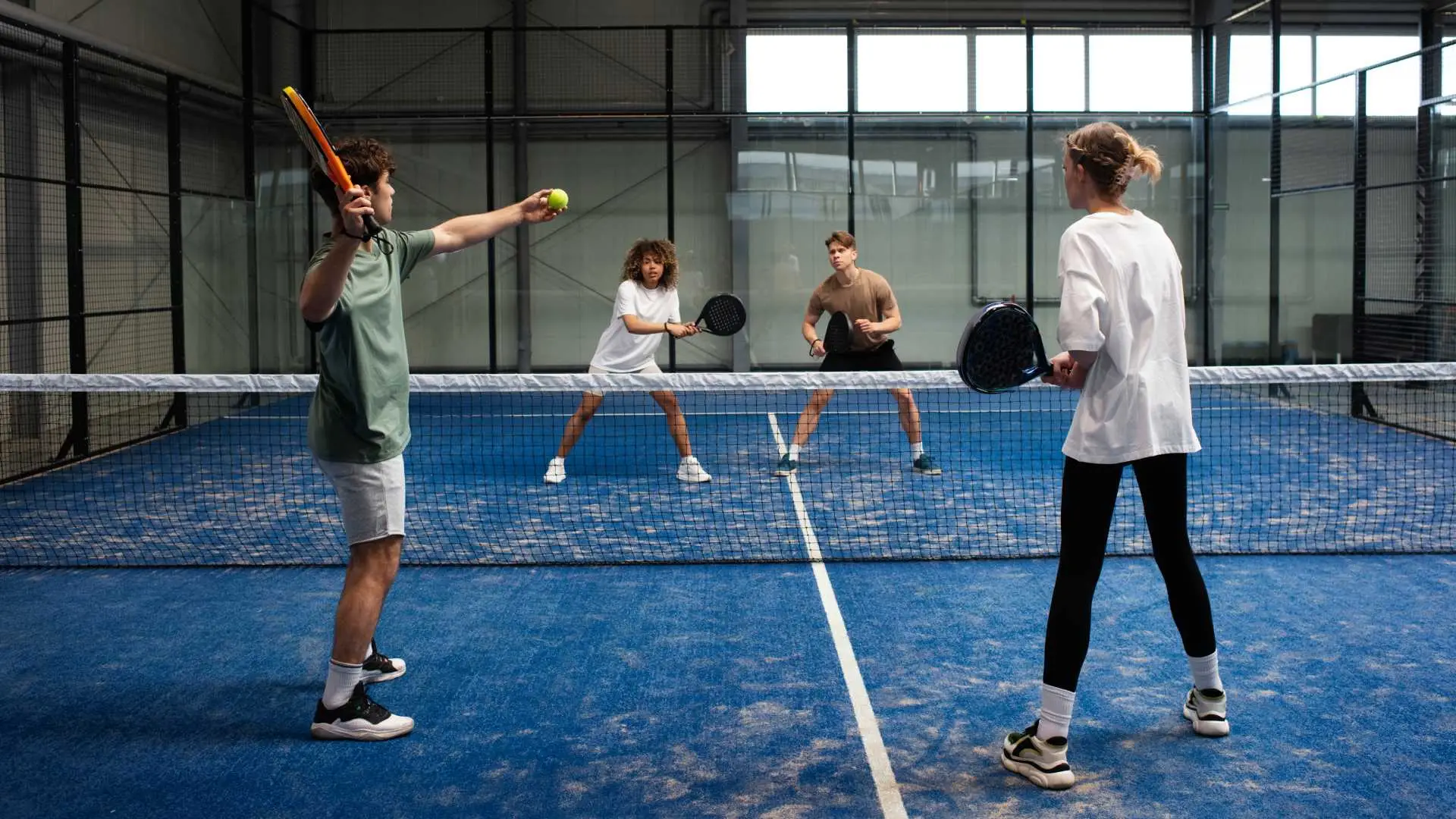 people-playing-padle-tennis-inside